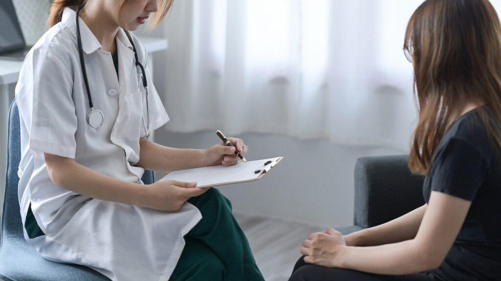 Professional psychologist consulting with patient at psychotherapy session.